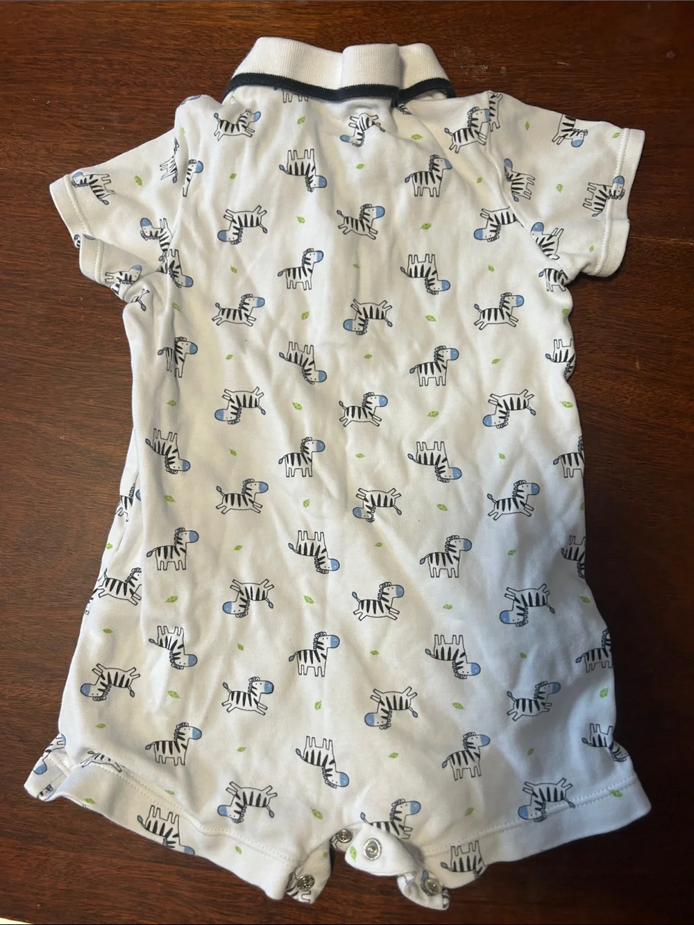 Little Me White Polo Romper with Blue Zebra Print and Green Accents